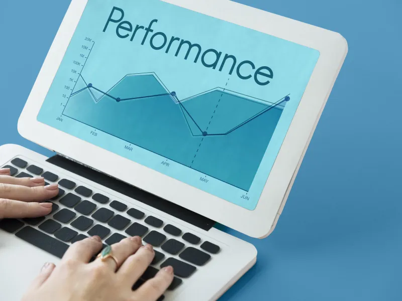Laptop showing a marketing performance chart