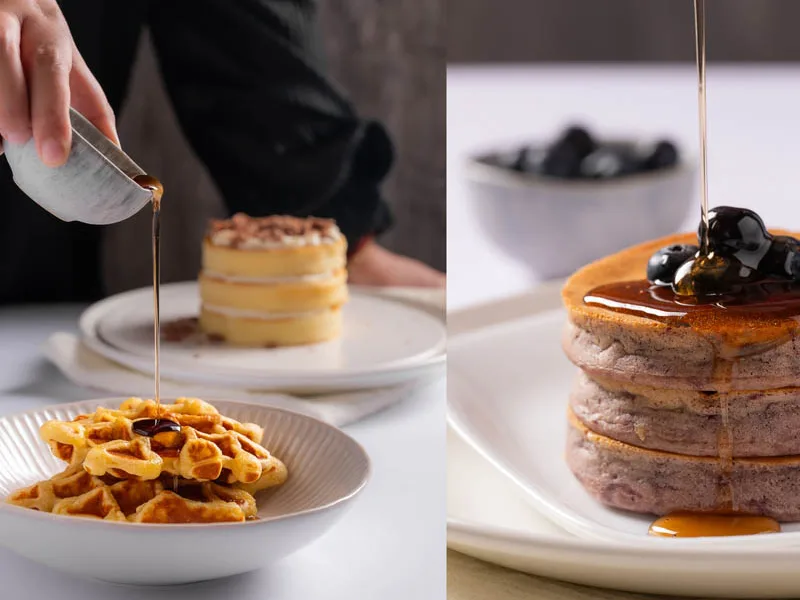 Syrup being poured over waffles and pancakes, a food story shot by Looptales